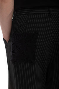 Split Code – men’s trousers in pinstripe and linen-blend knit