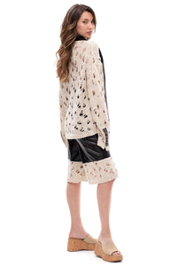 Edge Contrast – cropped eco-leather and knit shorts