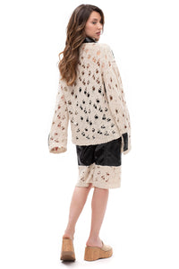 Edge Contrast – cropped eco-leather and knit shorts