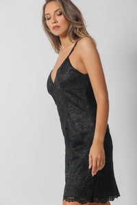 Short lace dress on a satin base with a triangular neckline