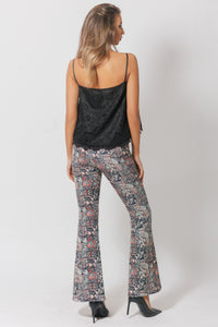 High-waisted bell-bottom pants with a graphic print